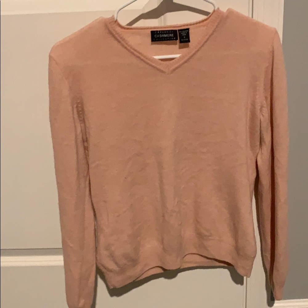 Light pink cashmere sweater.